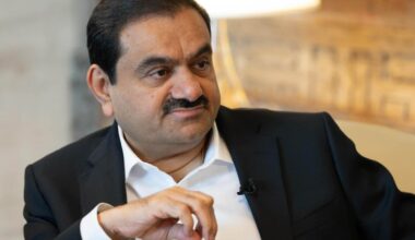Gautam Adani, chairman of Adani Group, sits during a television interview.