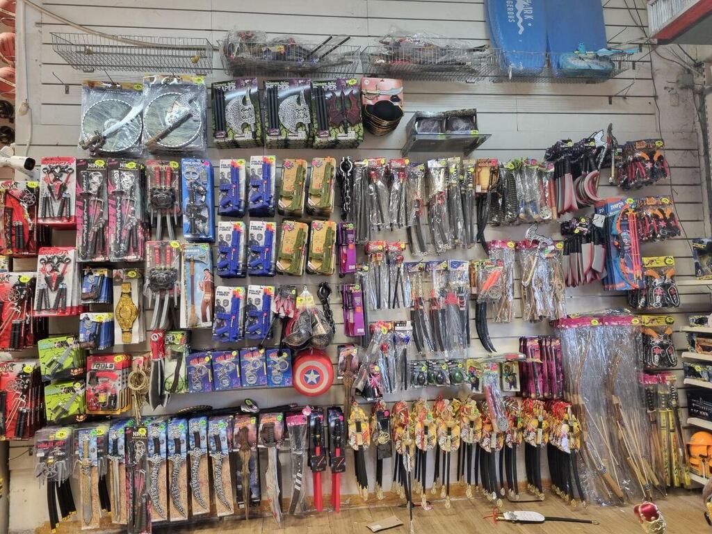 Firecrackers and toy weapons on display at a toy store ahead of Purim חנות ה צעצועים ילדים ודרקונים בנס ציונה
