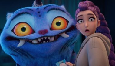 Rumi looks surprised at something behind her next to a giant tiger.