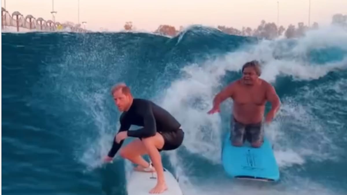 Prince Harry rides waves alongside a professional surfer in California- and it comes at a cost