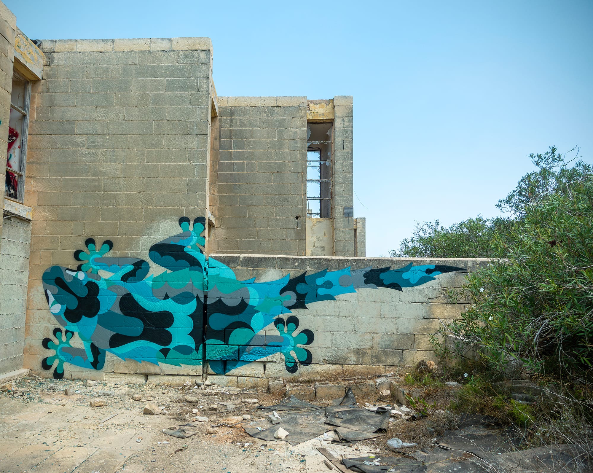 a vibrant abstracted mural of a critter by James Reka