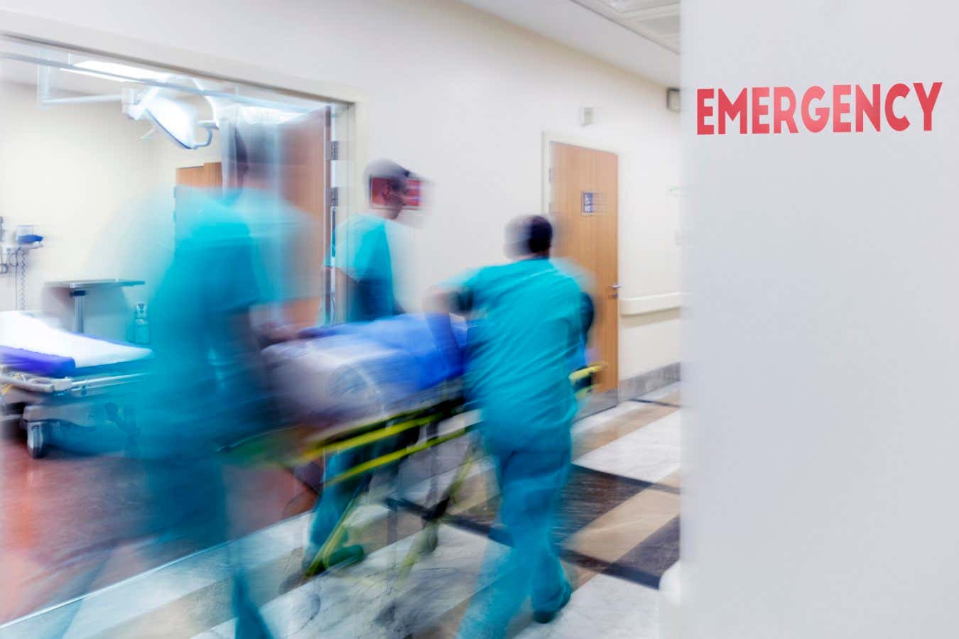 Doctor wheeling patient