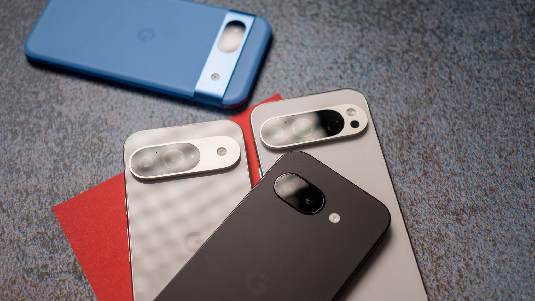 Google Pixel 9a camera island next to Pixel 9, 9 Pro, and 8a