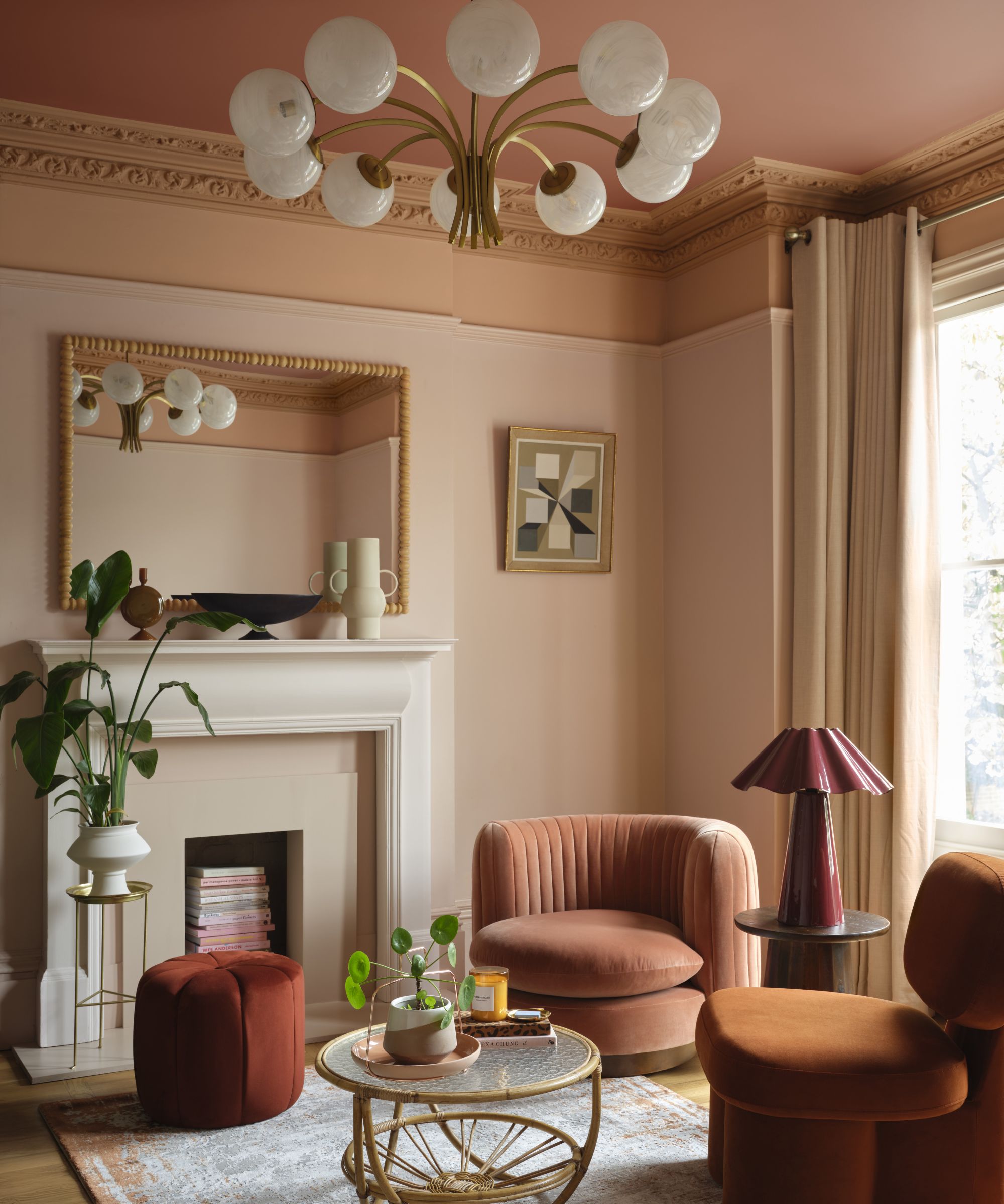 Living room in Queen Anne Pink by Benjamin Moore, layered with rich earthy tones