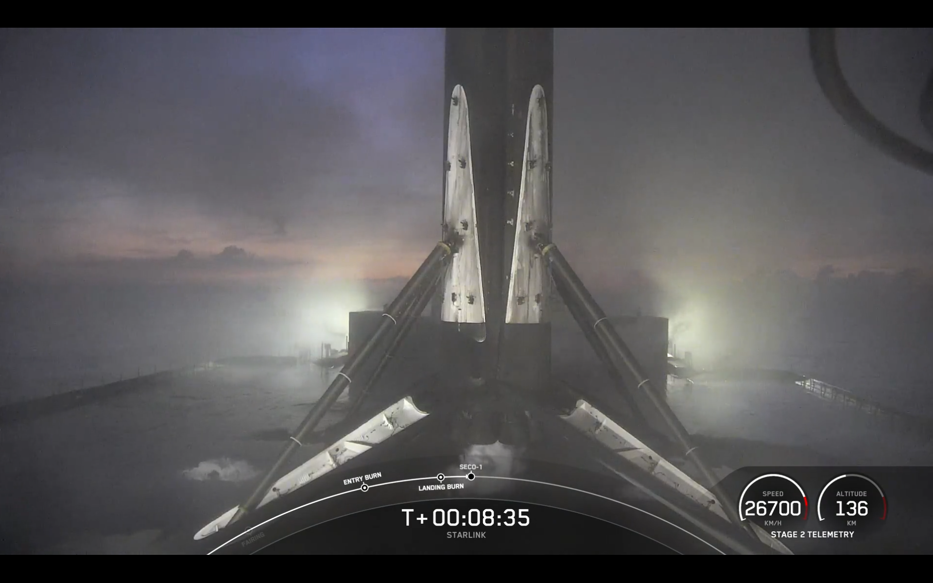 A black and white SpaceX rocket stands on a landing drone ship off the coast of the Bahamas on Feb. 18, 2025.
