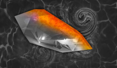 An illustration of a quartz crystal with facets of gray, black and white, with a gradient of red, orange and yellow at one end of the crystal, simulating a heat gradient.