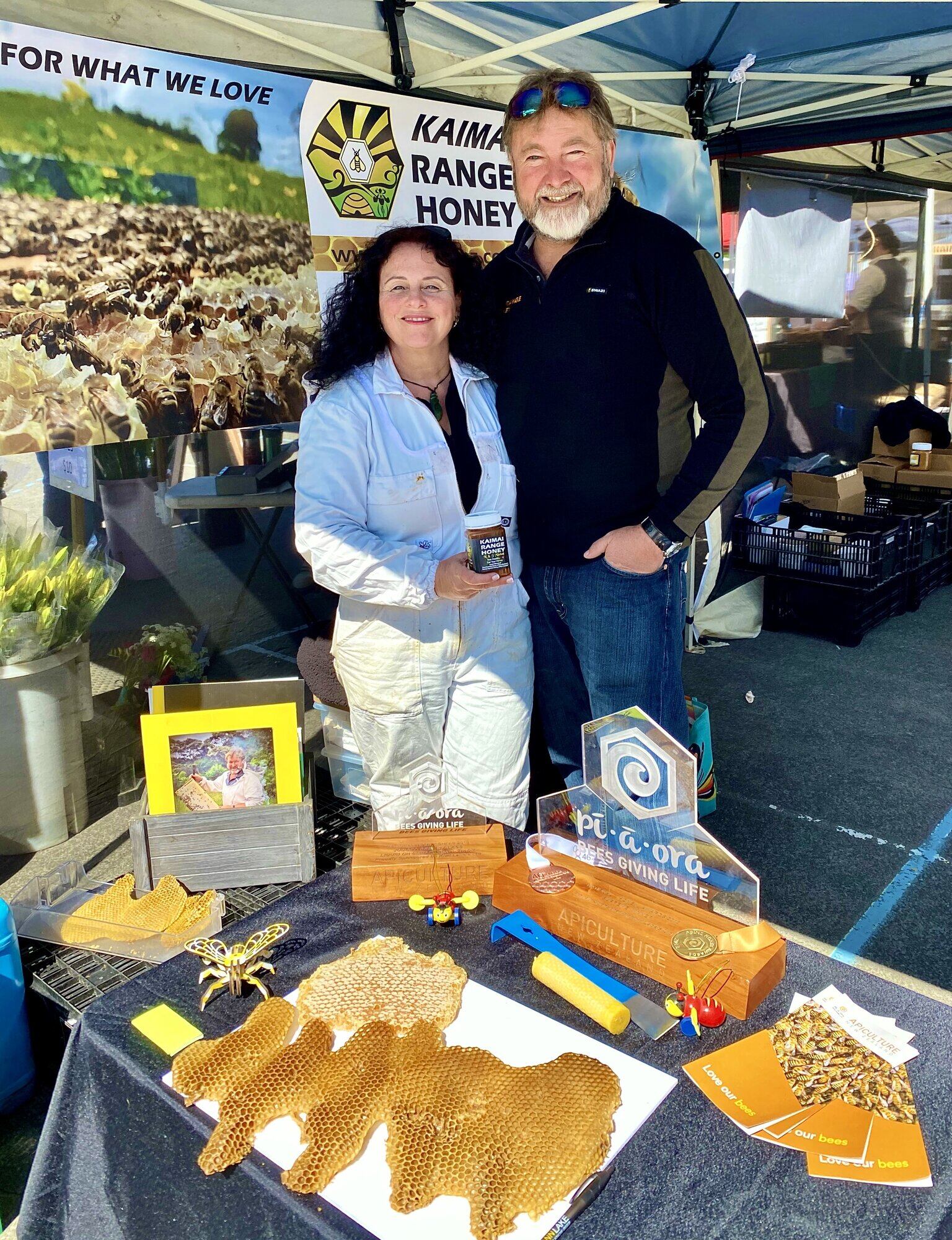 Ralph and Jody Mitchell promoting Bee Awareness Month at the Tauranga Farmer's Market.
