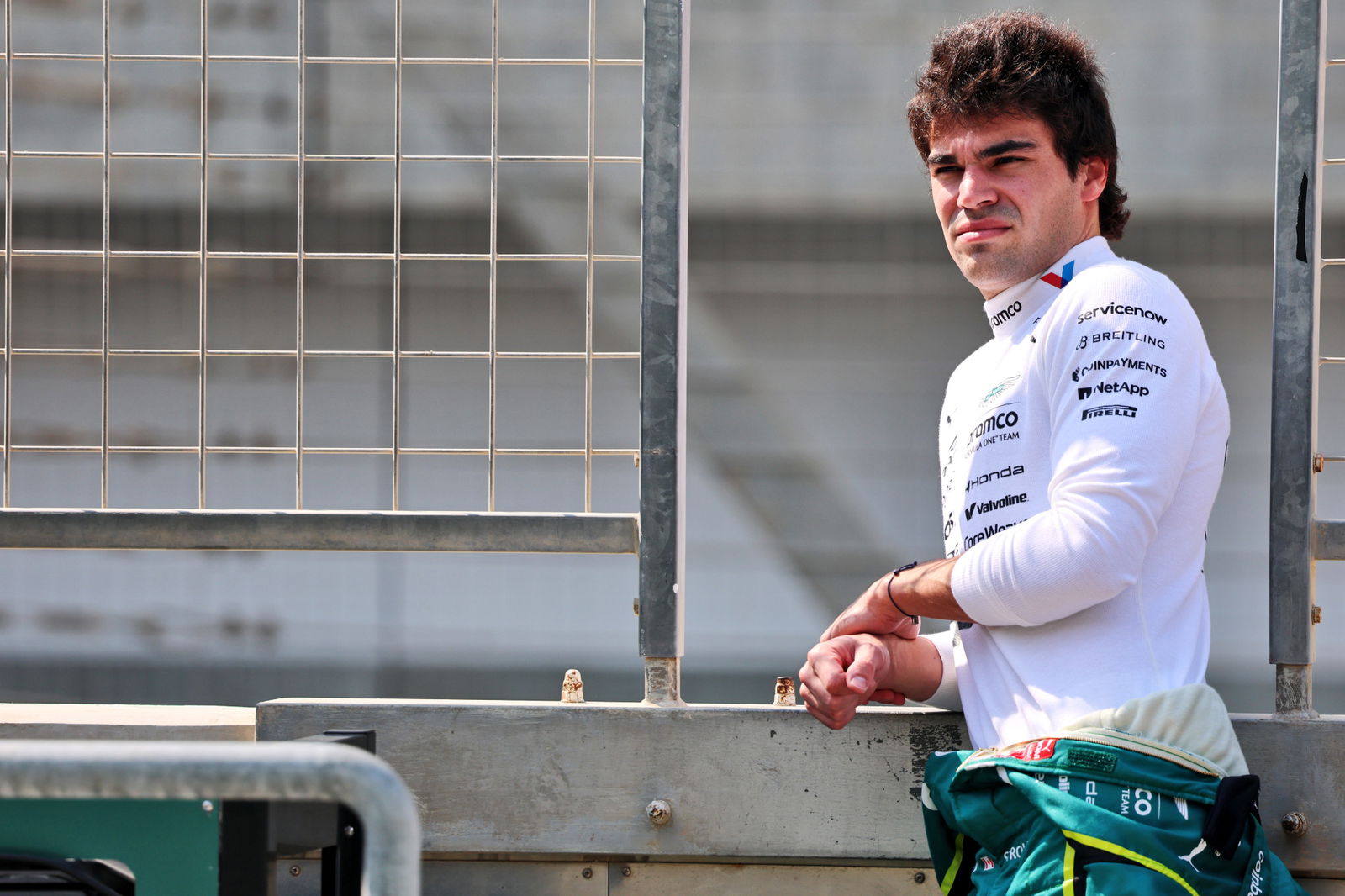 Lance Stroll looks on from the pit wall during Formula 1 pre-season testing at Bahrain.
