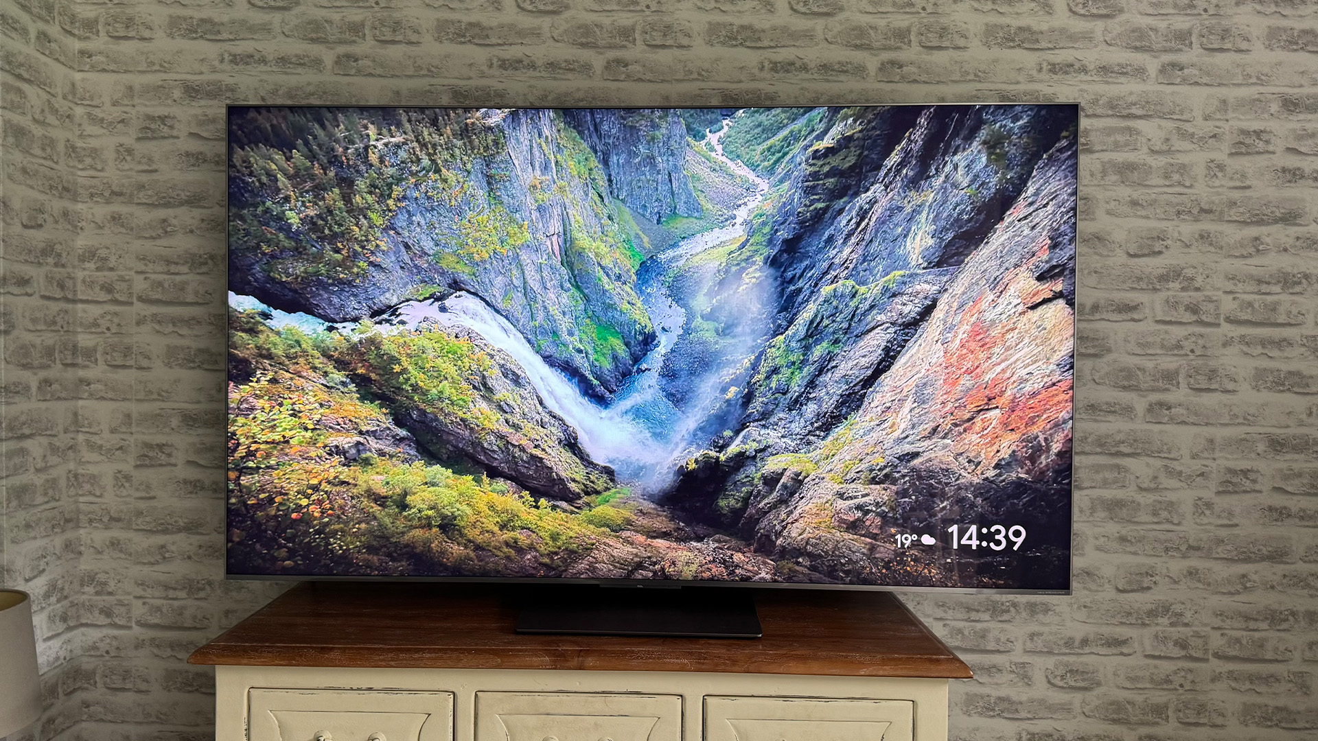 The 65-inch TCL C7K Mini LED TV photographed in a living room