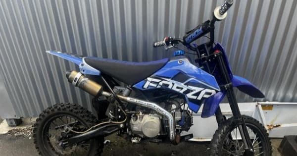 Dirt bike rider attempting to flee caught after stalling in driveway