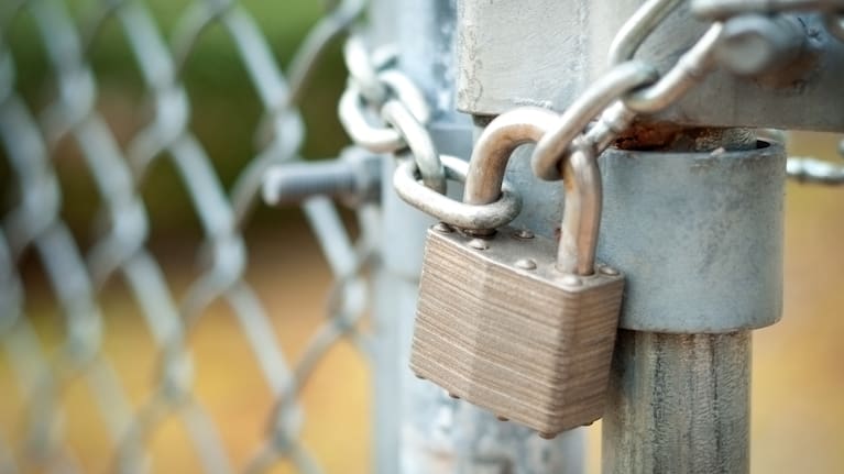A fence locked by a chain. 