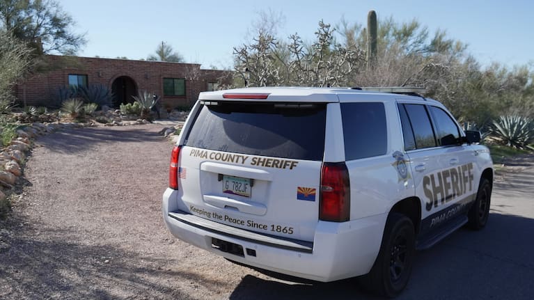 A Pima county sheriff's vehicle is parked out front of Nancy Guthrie’s home.