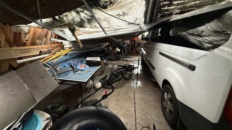 A tree through a garage at Te Horo Beach on the Kapiti Coast.