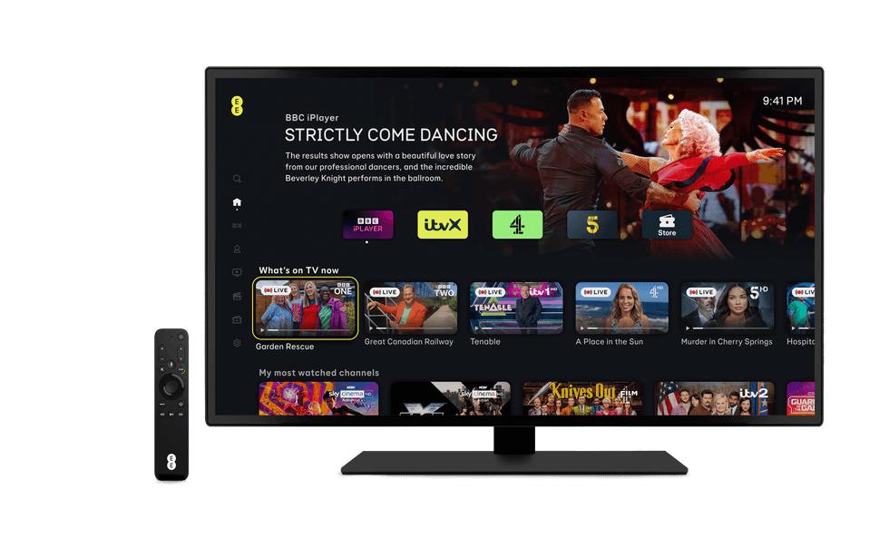 an apple tv remote control from ee alongside a television displays the ee tv menu