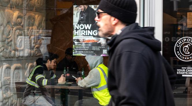 A 'Now Hiring' sign at a store in Manhattan, New York, on January 9, 2026.