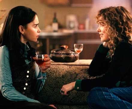 Bea and Twila sit on the couch talking in Ponies season 1