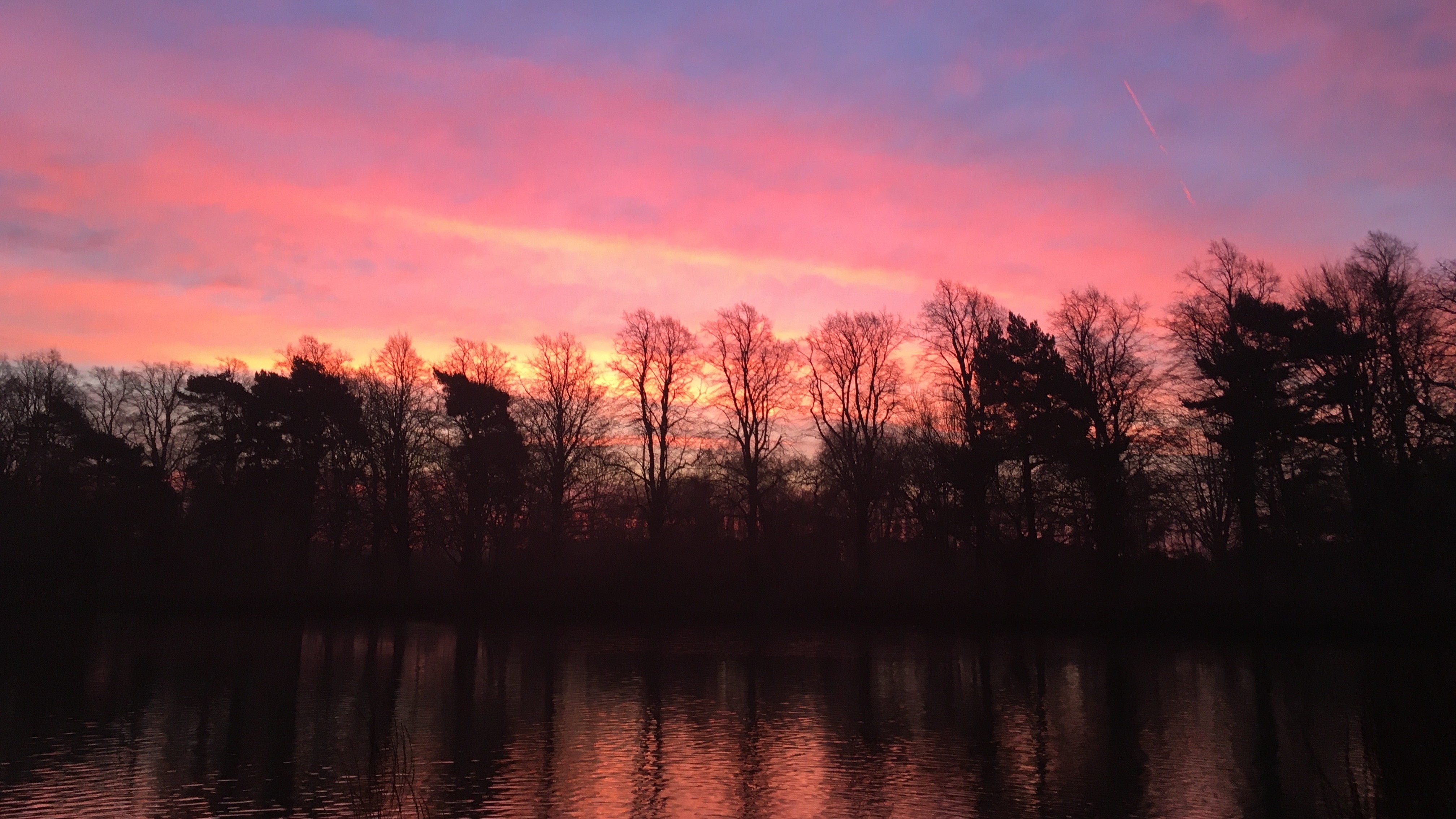 vibrant orange, pink and lilac sky