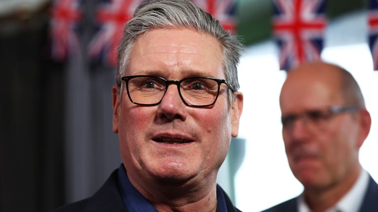 Britain's Prime Minister Keir Starmer talks with members of the audience after delivering a speech.