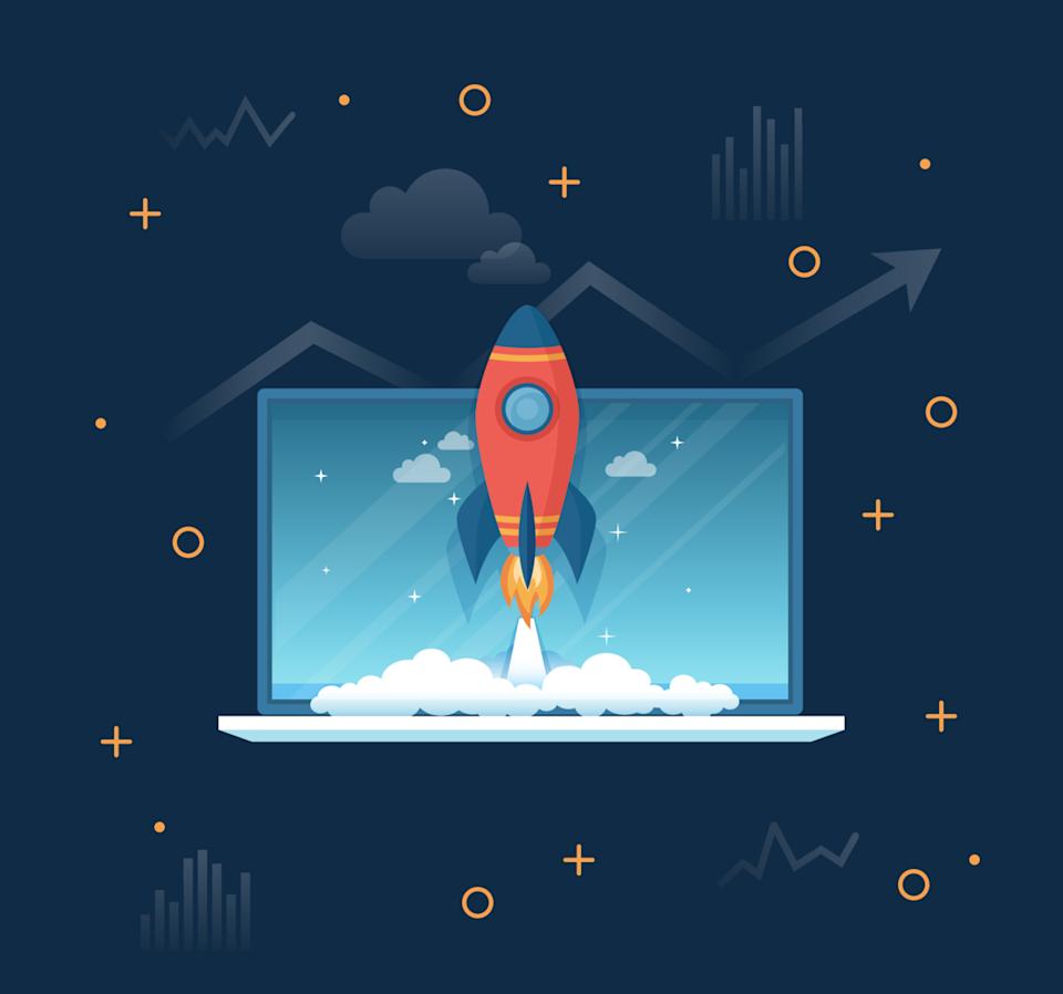 Cartoon rocket ship taking off from laptop.