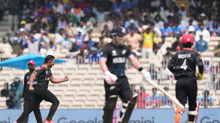 Canada's Saad Bin Zafar, left, celebrates the wicket of New Zealand's Tim Seifert during the T20 World Cup cricket match between Canada and New Zealand.