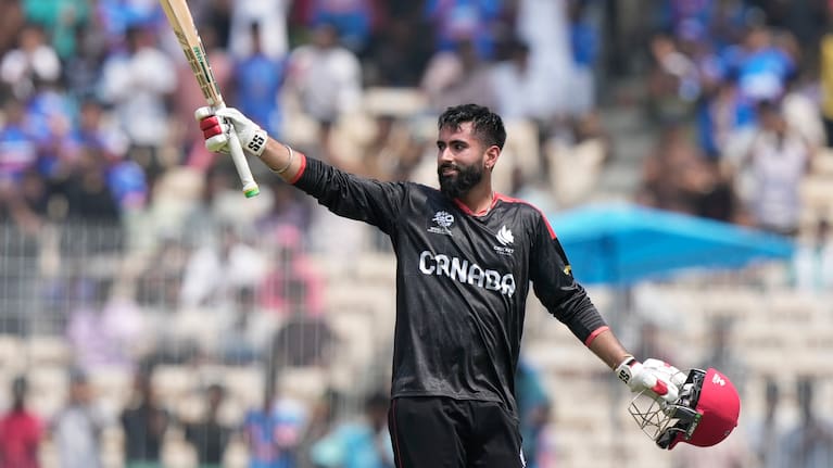Canada's Yuvraj Samra celebrates his century during the T20 World Cup cricket match between Canada and New Zealand in Chennai, India.