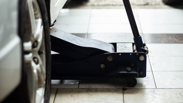 Car tire chang and check working in garage new tire