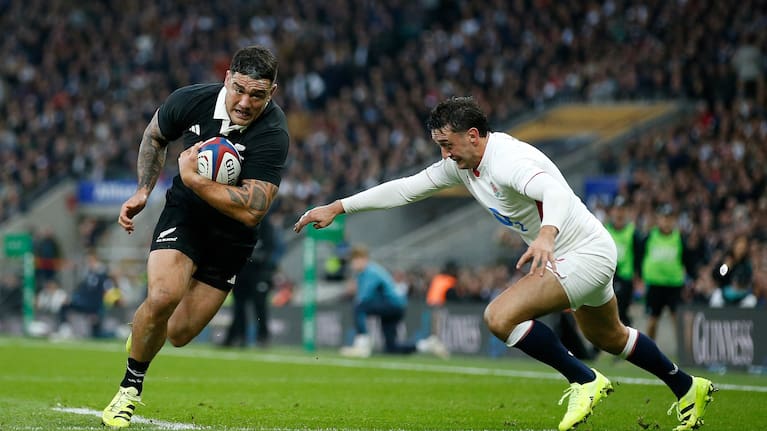Codie Taylor beats Alex Mitchell on the way to scoring a try in the All Blacks' defeat to England at Twickenham last November.