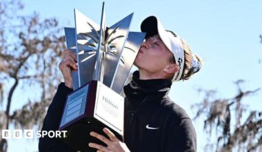 Nelly Korda kisses the winners trophy