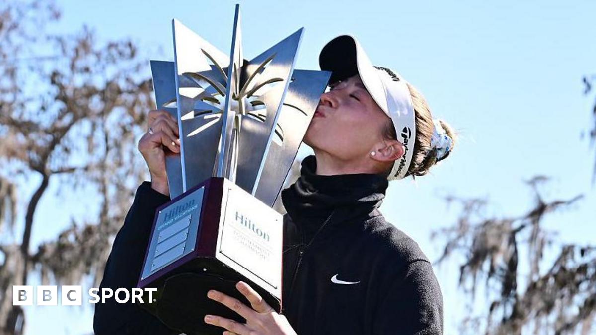Nelly Korda kisses the winners trophy