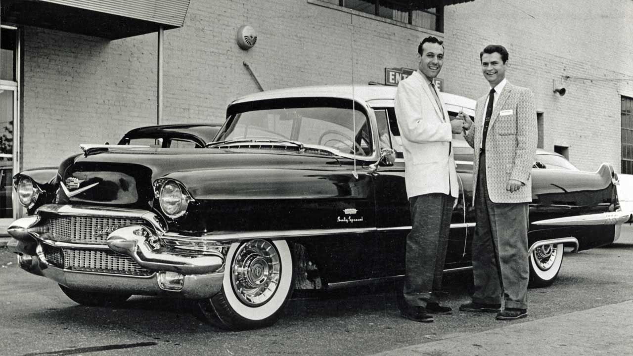 Sam Phillips presents Carl Perkins with a Cadillac outside Sun Studios