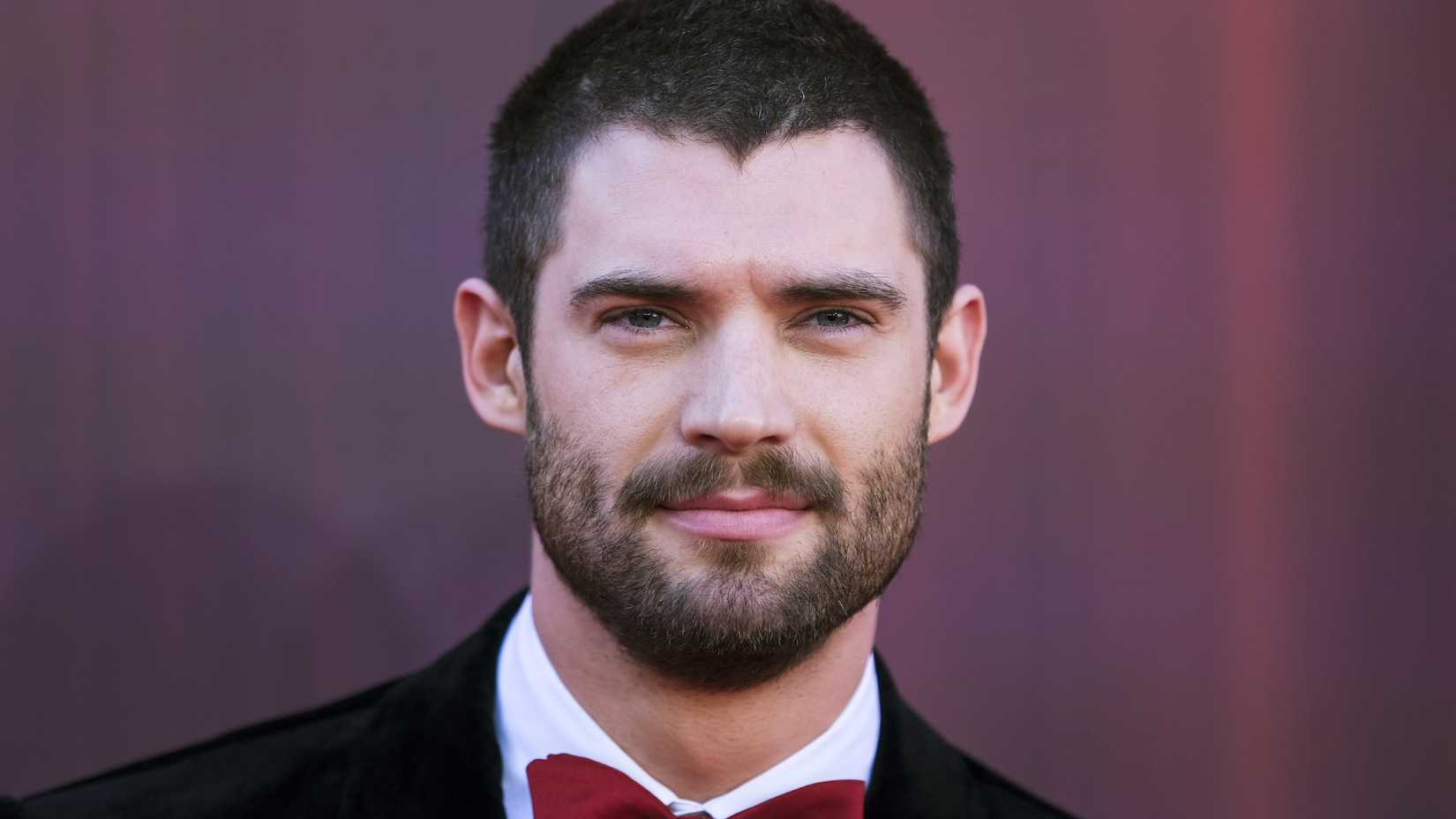 David Corenswet posing on a red carpet