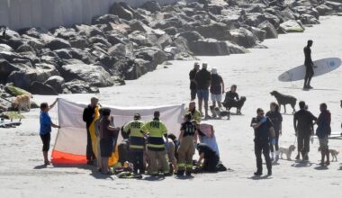 Surfer deeply upset as bid to save man fails