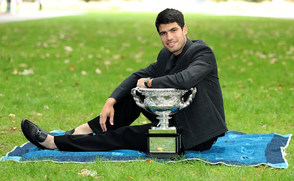 Carlos Alcaraz with the Australian Open trophy.