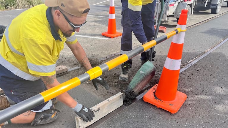 Eastland Port employees are filling in the railway lines beside the cycleway at the Tatapouri Fishing Club.