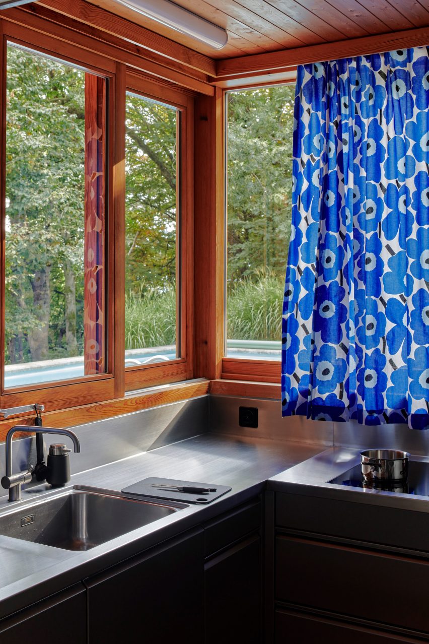 Stainless steel kitchen in renovated house in Vernate by Enrico Sassi