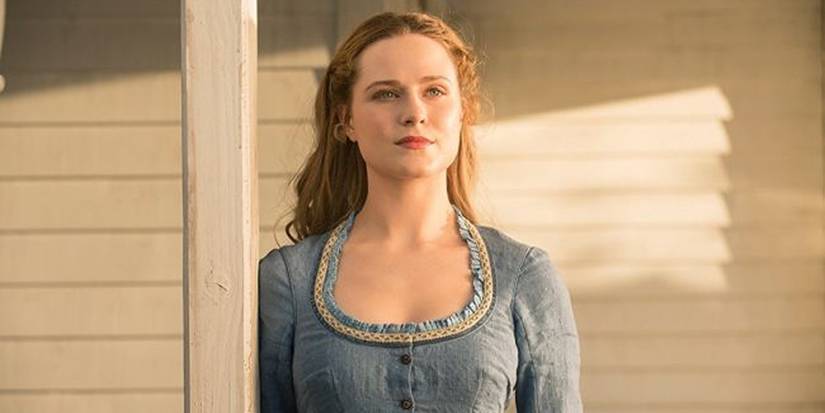 Evan Rachel Wood as Dolores Abernathy, looking into the distance in her iconic blue outfit in Westworld season 1