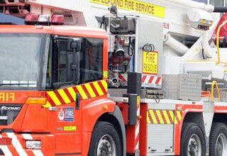 Winds fan vegetation fire near Clyde