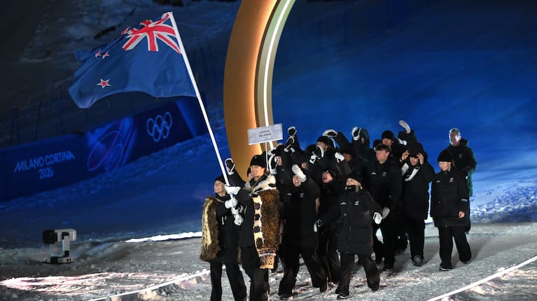 Flagbearers Zoi Sadowski-Synnott and Ben Barclay of Team New Zealand enter with the team into the stadium during the opening ceremony of the Milano Cortina 2026 Winter Olympics.