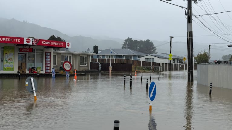 Flooding outside the Konini Superette in Wainuiomata.