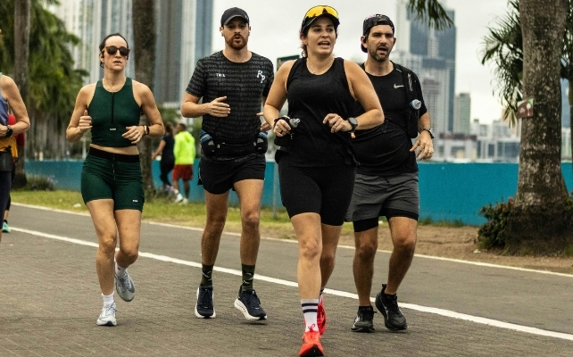 a group of people running outside