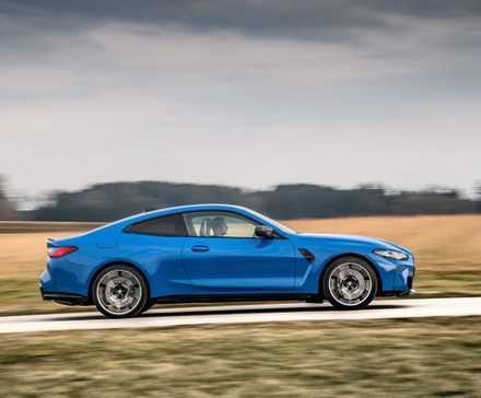 G82 BMW M4 Competition Coupe side driving view