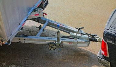 Fishtailing trailer hits ute and sends building materials flying