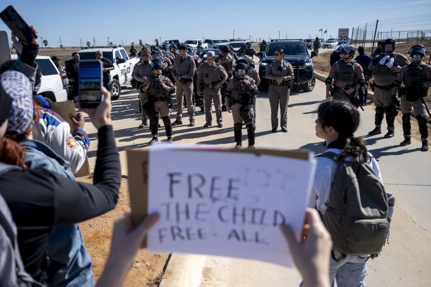 Texas State Troopers prepare to disperse a crowd protesting Immigration and Customs Enforcement outside the South Texas Family Residential Center in Dilley, Texas on January 28.