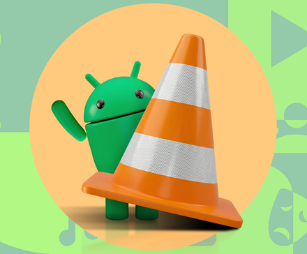 Green Android mascot peeking from behind a large orange VLC traffic cone on a patterned background.