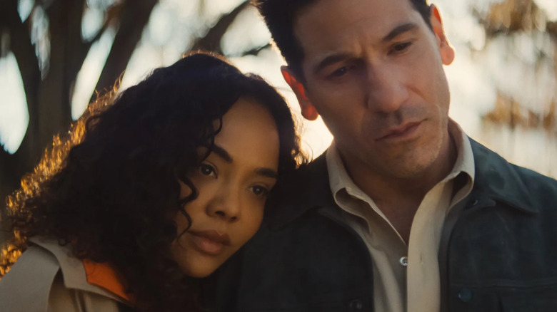 Tessa Thompson as Anna Andrews and Jon Bernthal as Detective Jack Harper, leaning on each other in His and Hers