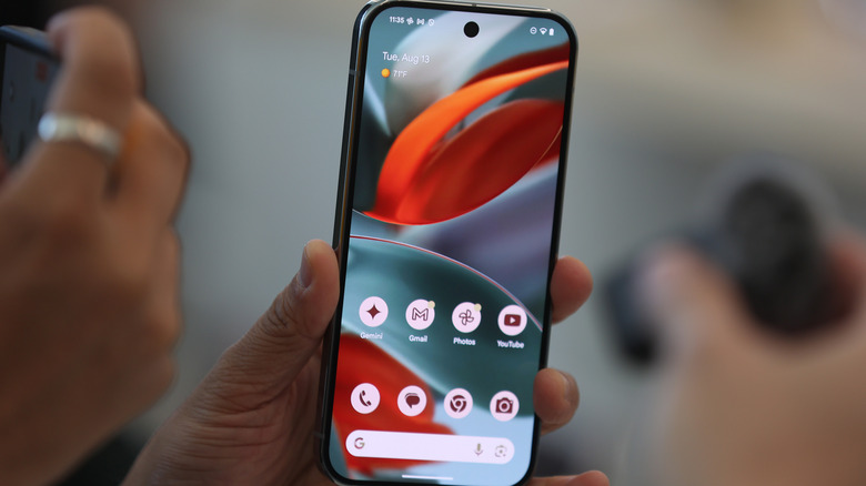 The Google Pixel 9 phone in hand.