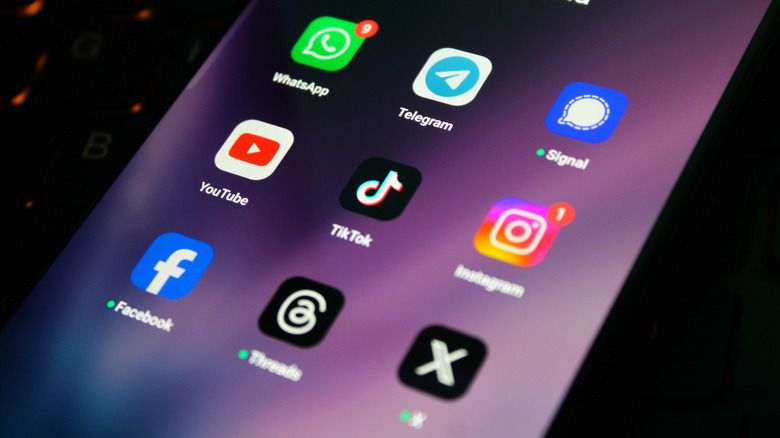 Messaging and social media apps, including WhatsApp, Telegram, Signal, and Instagram displayed on a smartphone screen.