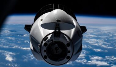 A SpaceX Dragon cargo spacecraft with its nosecone open and carrying over 5,000 pounds of science, supplies, and hardware for NASA's SpaceX CRS-33 mission approaches the International Space Station for an automated docking to the Harmony module's forward port. Both spacecraft were flying 261 miles above the Atlantic Ocean south of the Azores, a Portuguese archipelago, at the time of this photograph.