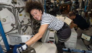 Expedition 74 Flight Engineers Jessica Meir and Chris Williams, both NASA astronauts, collect frozen research samples from inside the International Space Station's Destiny laboratory module. The samples were stowed inside science freezers aboard a SpaceX Dragon spacecraft for retrieval and analysis on Earth.