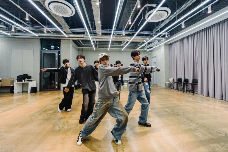 The group practice dance routines the week before their first solo concert.